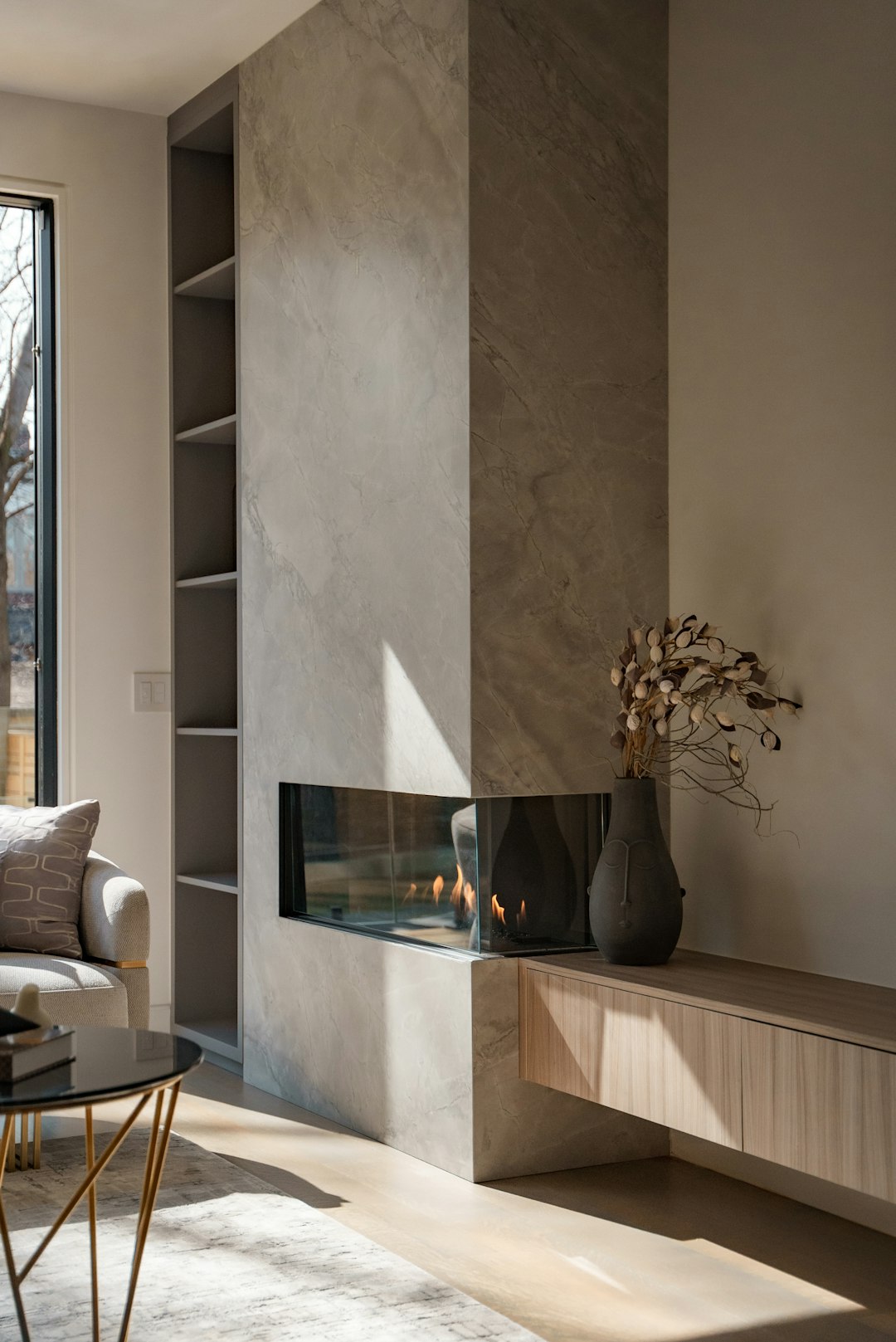 Home a-room-with-a-fireplace-and-a-shelf-with-a-plant-in-it-0n5yrjgb0js