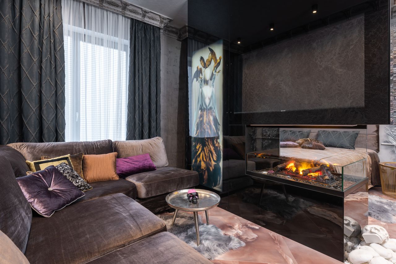 Crafting Captivating Headlines: Your awesome post title goes here Interior of modern cozy apartment with comfortable sofa placed near contemporary burning firewood in room with bed at stylish home